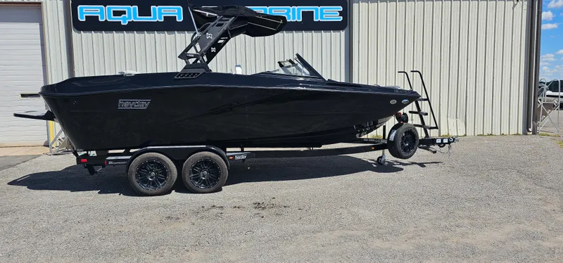 Slide: The Image of 2024 Heyday H22 boat on trailer outside Aqua Marine building. - 2