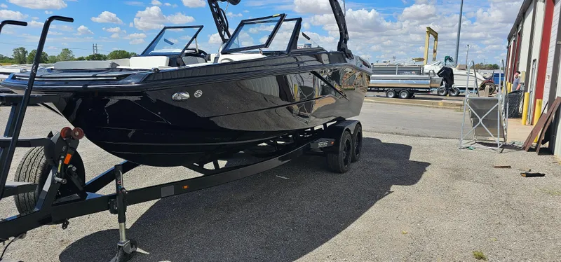 Slide: The Image of 2024 Heyday H22 boat on trailer, parked outdoors under a blue sky. - 3