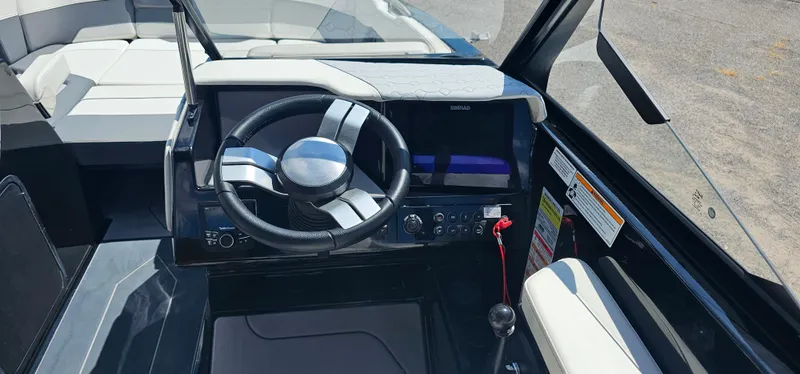 Slide: The Image of 2024 Heyday H22 boat cockpit with steering wheel and control panel. - 8