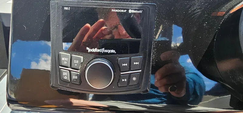 Slide: The Image of Close-up of Rockford Fosgate audio system on 2024 Heyday H22 boat dashboard. - 9