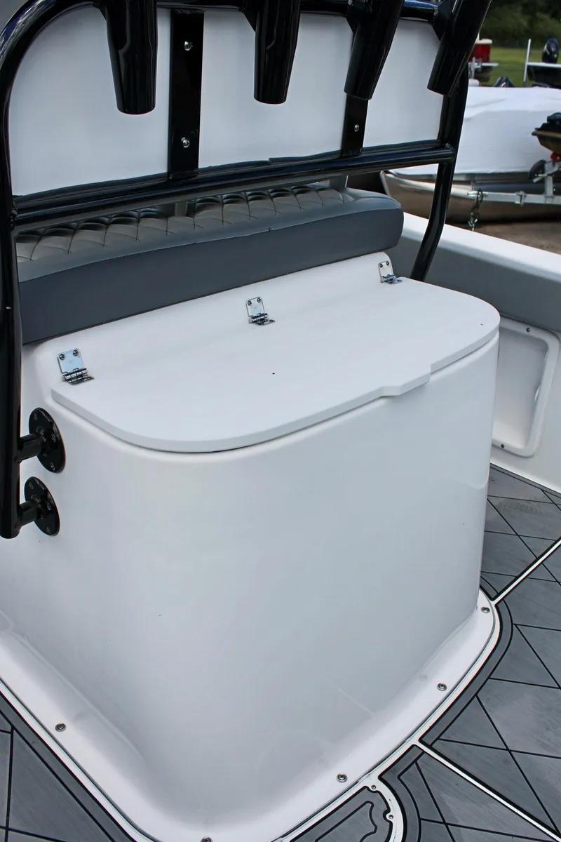 Slide: The Image of 2024 Clearwater 2200 WI Center Console boat seating and storage area. - 11