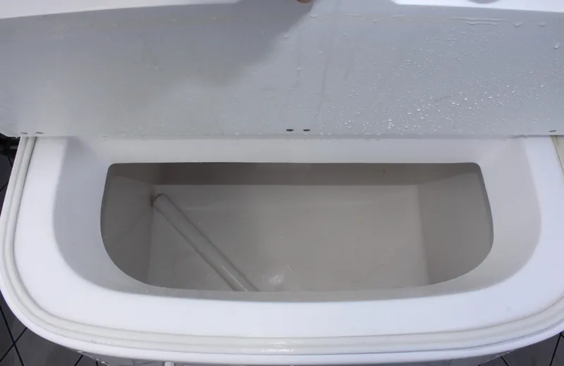 Slide: The Image of Open storage compartment of 2024 Clearwater 2200 WI Center Console boat. - 12