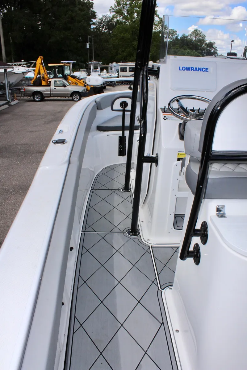 Slide: The Image of 2024 Clearwater 2200 WI Center Console boat interior with modern design and navigation equipment. - 13