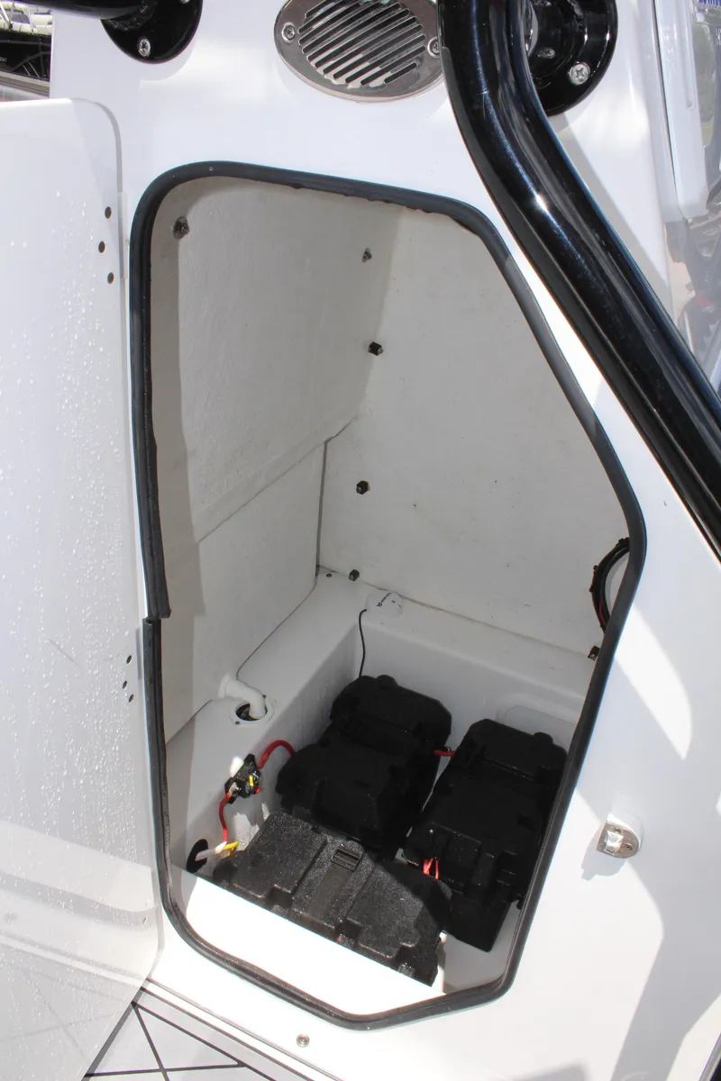 Slide: The Image of 2024 Clearwater 2200 WI Center Console boat battery compartment. - 22