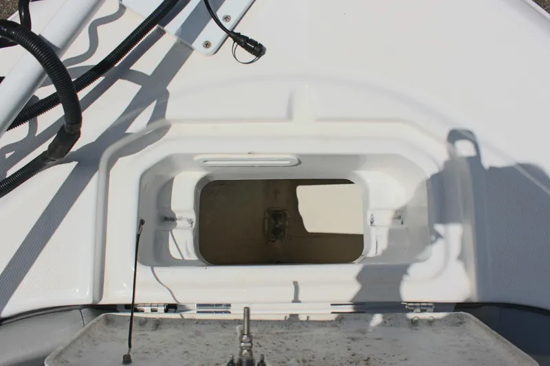 Slide: The Image of 2024 Clearwater 2200 WI Center Console boat storage compartment detail. - 28
