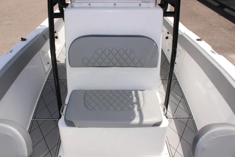 Slide: The Image of 2024 Clearwater 2200 WI Center Console boat interior with cushioned seating. - 29