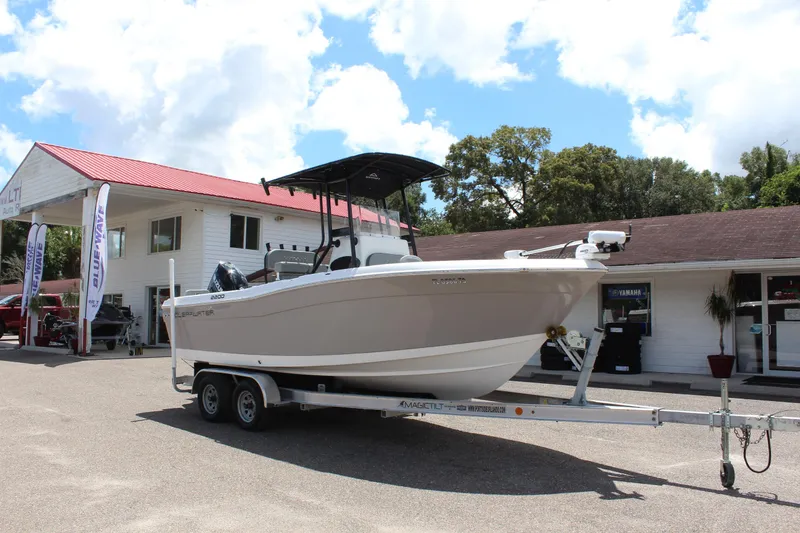Slide: The Image of 2024 Clearwater 2200 WI Center Console boat on trailer, parked outdoors. - 3