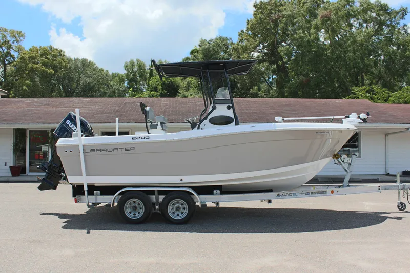 Slide: The Image of 2024 Clearwater 2200 WI Center Console boat on trailer, side view. - 4