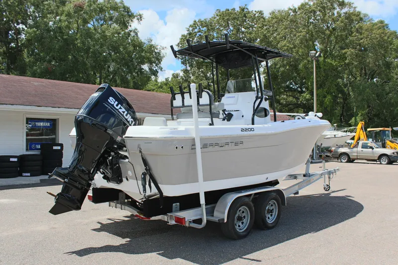 Slide: The Image of 2024 Clearwater 2200 WI Center Console boat on trailer with Suzuki outboard motor. - 5