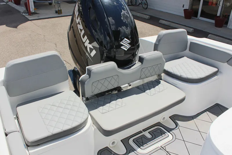 Slide: The Image of 2024 Clearwater 2200 WI Center Console boat with Suzuki outboard motor and cushioned seating. - 8