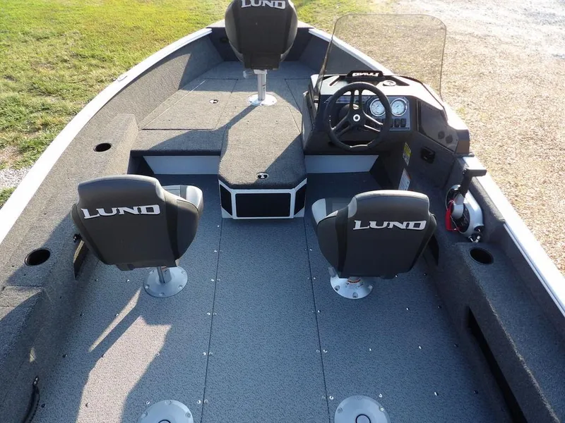Slide: The Image of 2025 Lund 1775 Adventure SS boat interior with seating and steering console. - 10
