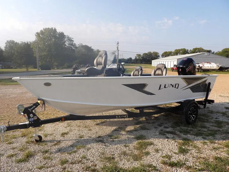 Slide: The Image of 2025 Lund 1775 Adventure SS boat on trailer, parked outdoors. - 13