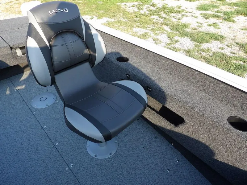 Slide: The Image of 2025 Lund 1775 Adventure SS boat seat, black and gray design, on textured deck. - 18