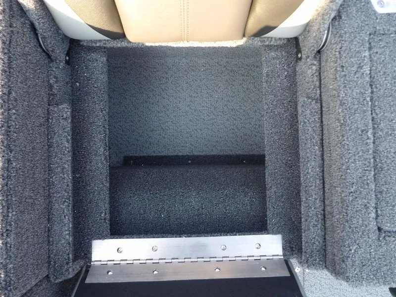Slide: The Image of 2025 Lund 1775 Adventure SS boat interior storage compartment with carpeted finish. - 2