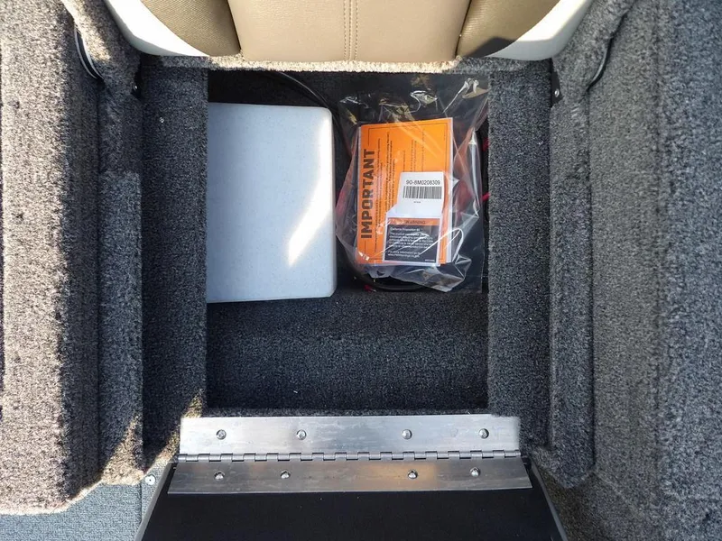 Slide: The Image of Storage compartment in 2025 Lund 1775 Adventure SS boat with important documents. - 21