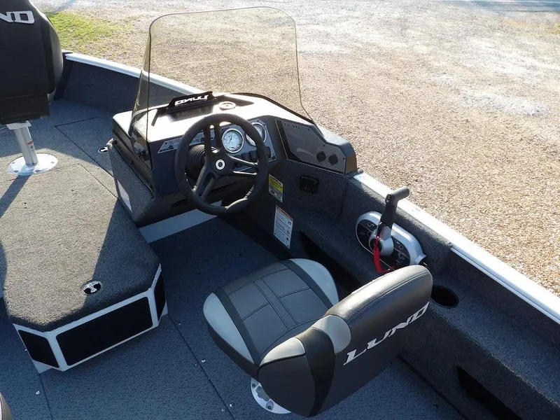 Slide: The Image of 2025 Lund 1775 Adventure SS boat interior with steering console and seating. - 24