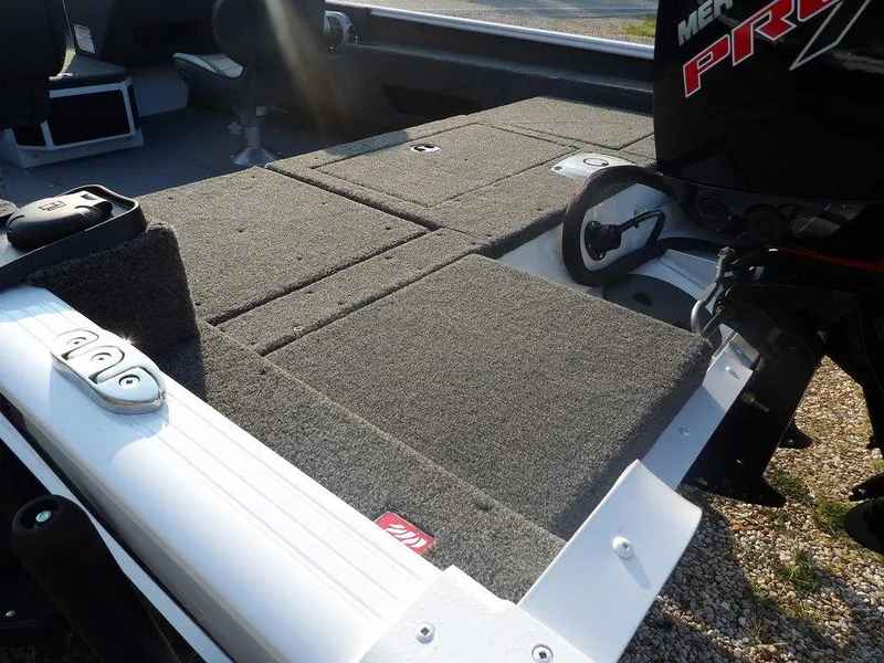 Slide: The Image of 2025 Lund 1775 Adventure SS boat deck with carpeted surface and motor. - 27