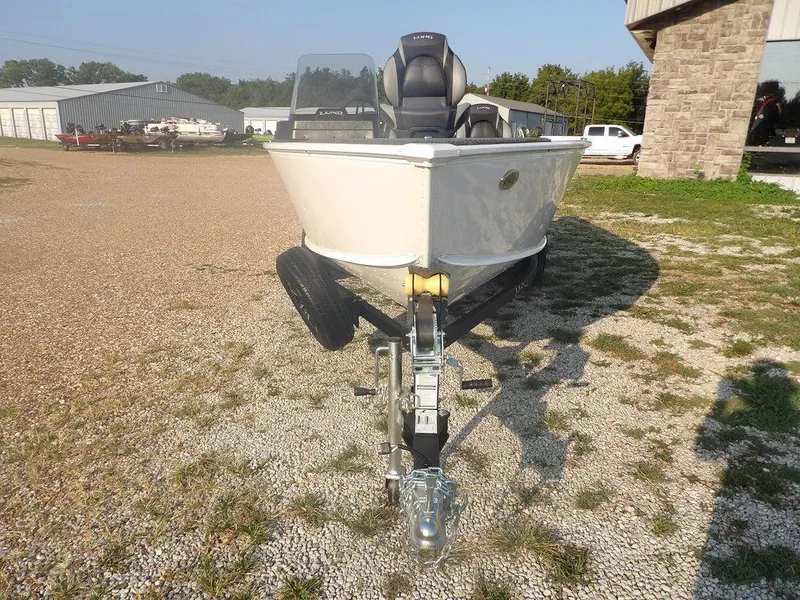 Slide: The Image of 2025 Lund 1775 Adventure SS boat on trailer, parked outdoors. - 28