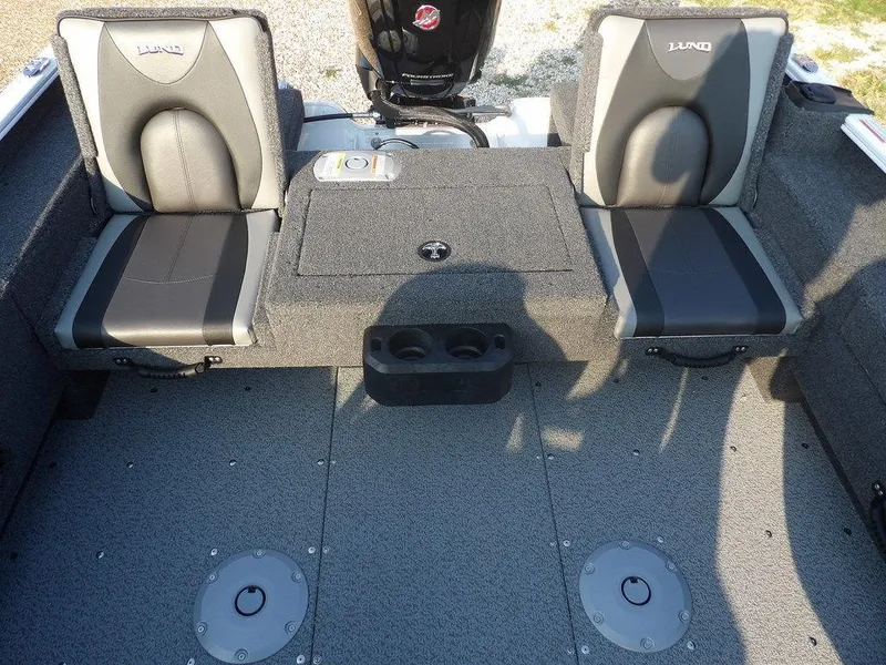 Slide: The Image of 2025 Lund 1775 Adventure SS boat interior with two cushioned seats and storage compartments. - 31