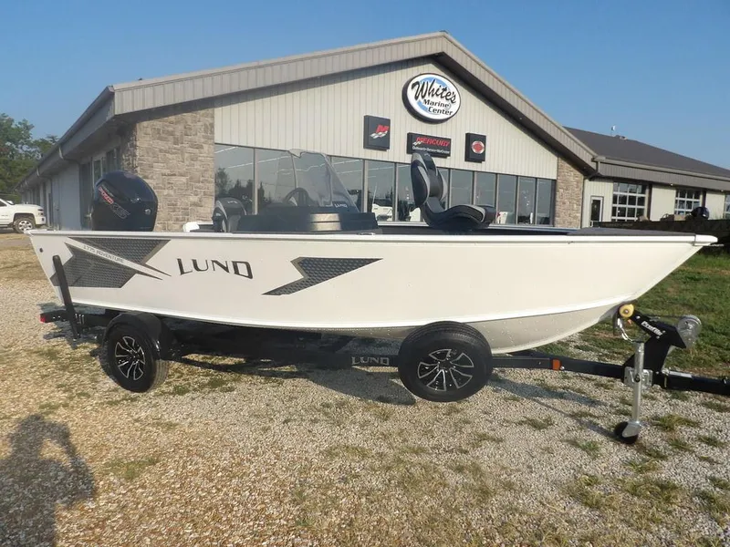 Slide: The Image of 2025 Lund 1775 Adventure SS boat on trailer outside dealership. - 32
