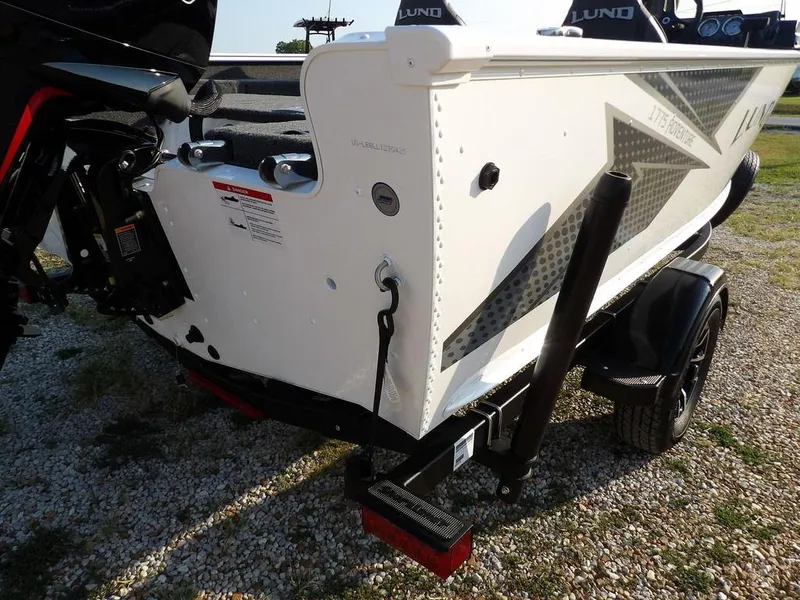 Slide: The Image of 2025 Lund 1775 Adventure SS boat on trailer, rear view, white with black accents. - 45