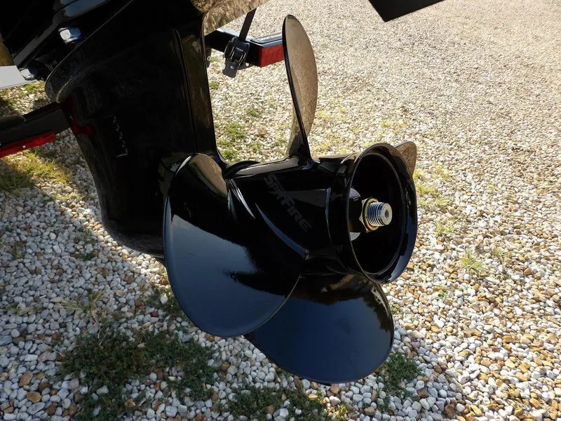 Slide: The Image of Close-up of a 2025 Lund 1775 Adventure SS boat propeller on gravel. - 47