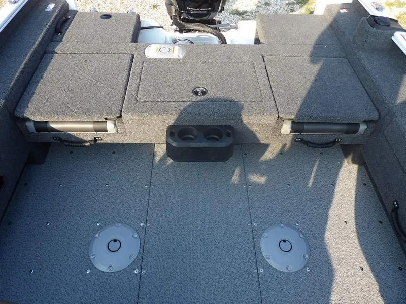 Slide: The Image of 2025 Lund 1775 Adventure SS boat interior with storage compartments and seating. - 8