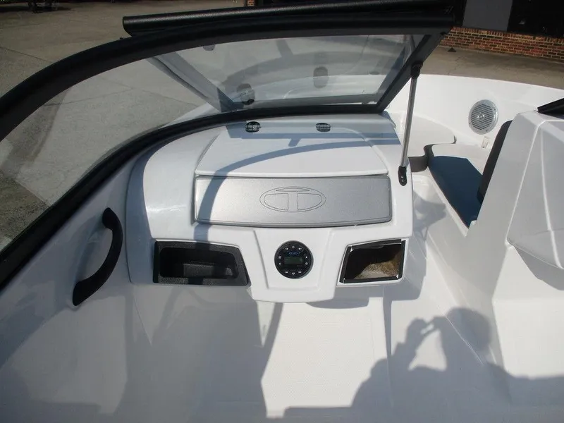 Slide: The Image of 2023 Tahoe 185 S boat dashboard with open windshield and control panel. - 9