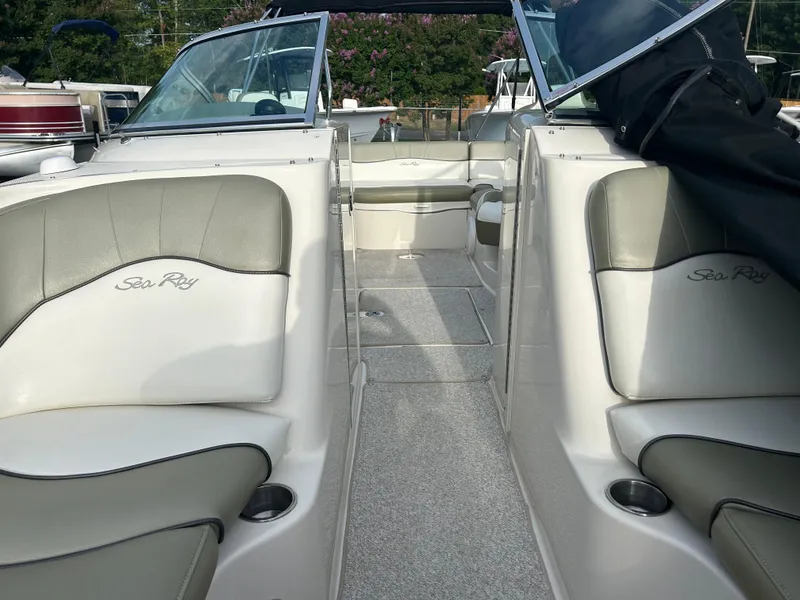 Slide: The Image of 2007 Sea Ray 240 Sundeck interior with gray seating and open deck layout. - 10