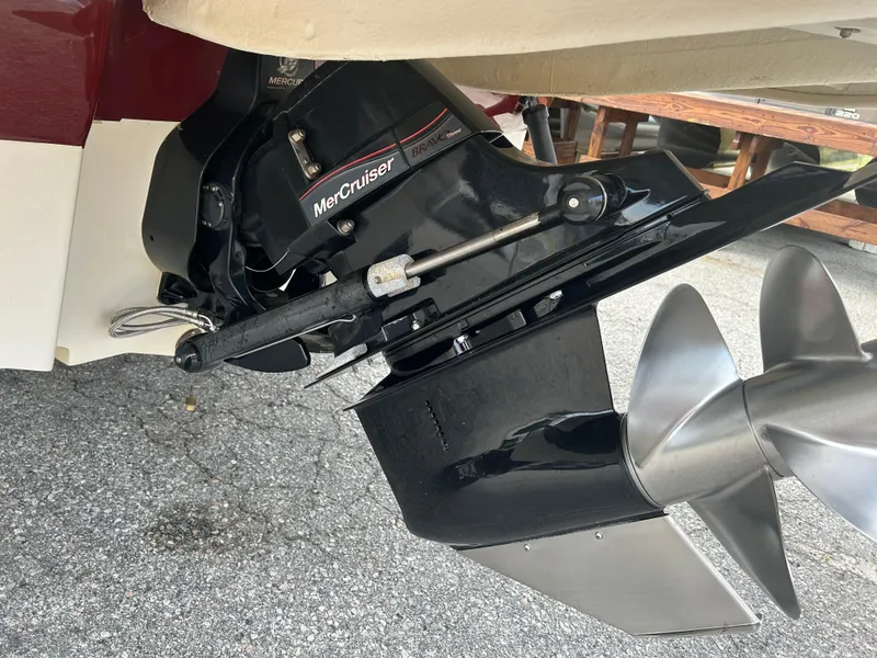 Slide: The Image of MerCruiser outdrive on a 2007 Sea Ray 240 Sundeck, featuring a stainless steel propeller. - 11