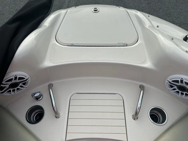 Slide: The Image of 2007 Sea Ray 240 Sundeck boat deck with speakers and stainless steel fittings. - 14