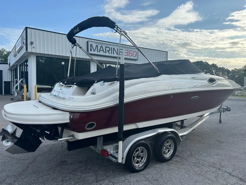 Slide: The Image of 2007 Sea Ray 240 Sundeck boat on trailer, parked outside Marine 360 dealership. - 4