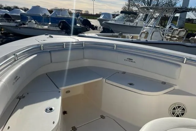 Slide: The Image of 2020 Cobia 237 Center Console boat interior with seating and storage. - 6