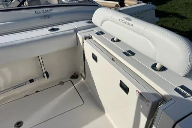 Slide: The Image of 2020 Cobia 237 Center Console boat interior with seating and storage compartments. - 9