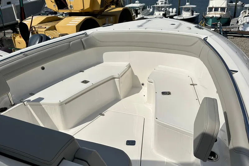 Slide: The Image of 2025 Pursuit S 288 Sport boat interior with spacious seating and storage. - 5