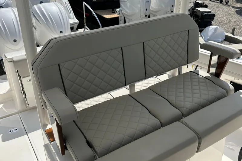 Slide: The Image of 2025 Pursuit S 288 Sport boat with quilted gray seating. - 6