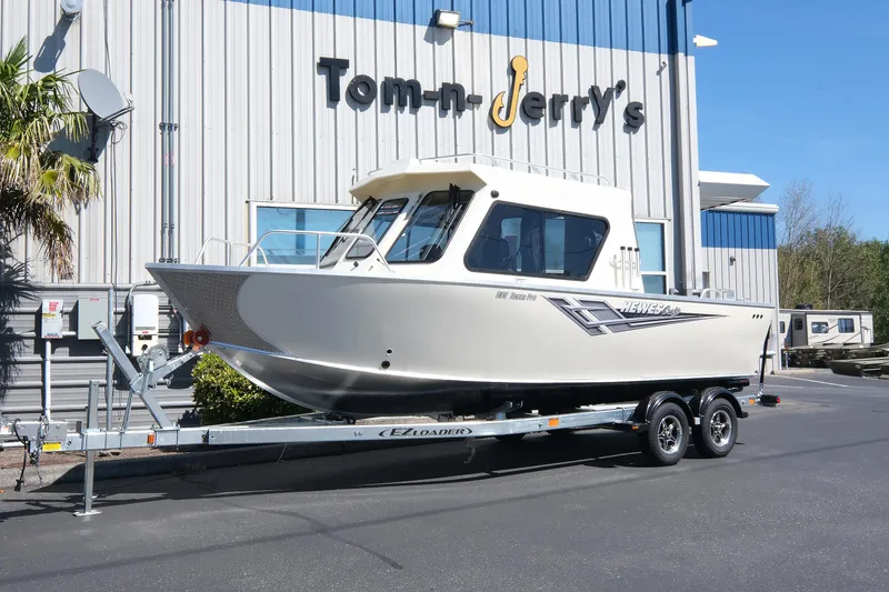 The Image of 2025 Hewescraft 220 Ocean Pro ET HT boat on trailer outside dealership. - 0