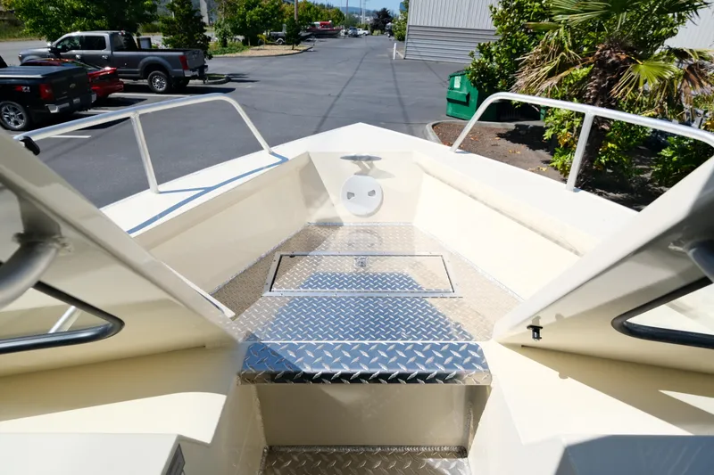 Slide: The Image of 2025 Hewescraft 220 Ocean Pro ET HT boat deck with diamond plate flooring. - 13