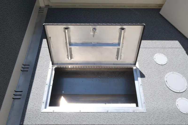 Slide: The Image of Open storage compartment on 2025 Hewescraft 220 Ocean Pro ET HT boat. - 16