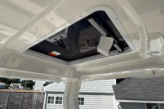 Slide: The Image of 2026 Pursuit S 328 Sport boat roof hatch, showcasing sleek design and modern features. - 23