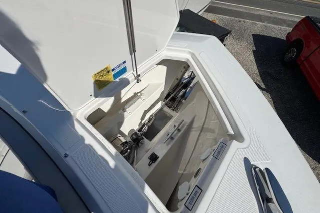 Slide: The Image of Open storage compartment on 2026 Pursuit S 328 Sport boat, showing interior details. - 29