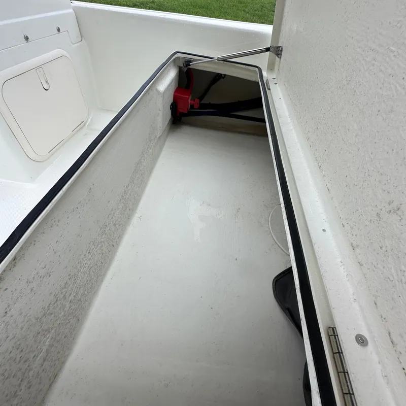 Slide: The Image of 2024 Rigid Boats 17' Sport storage compartment interior view. - 10