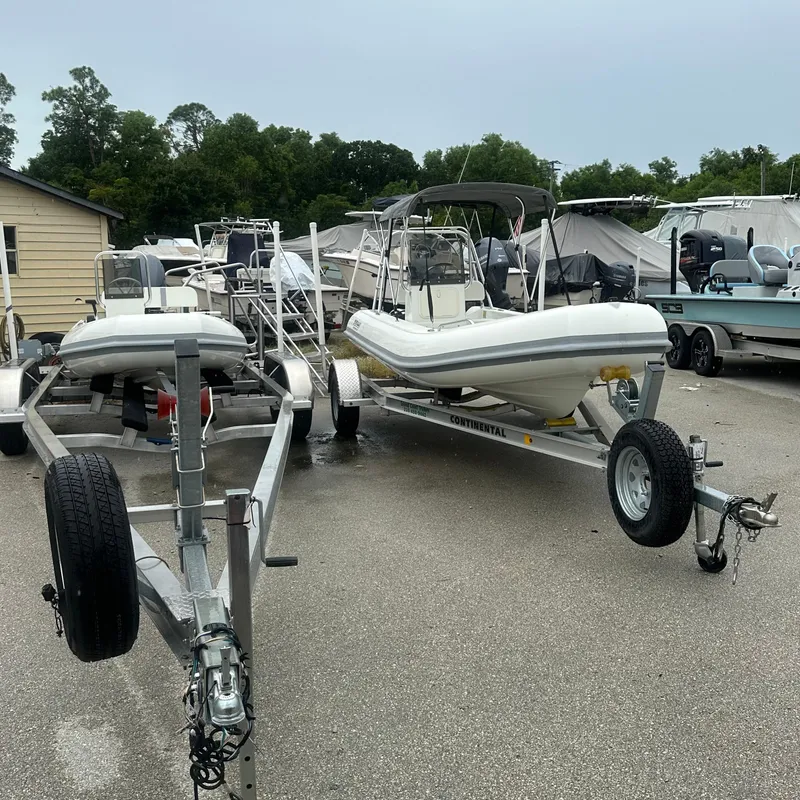 Slide: The Image of 2024 Rigid Boats 17' Sport on trailer in outdoor lot. - 20