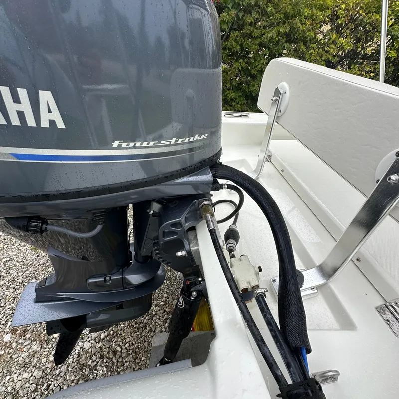 Slide: The Image of 2024 Rigid Boats 17' Sport with Yamaha four-stroke engine, rear view. - 8