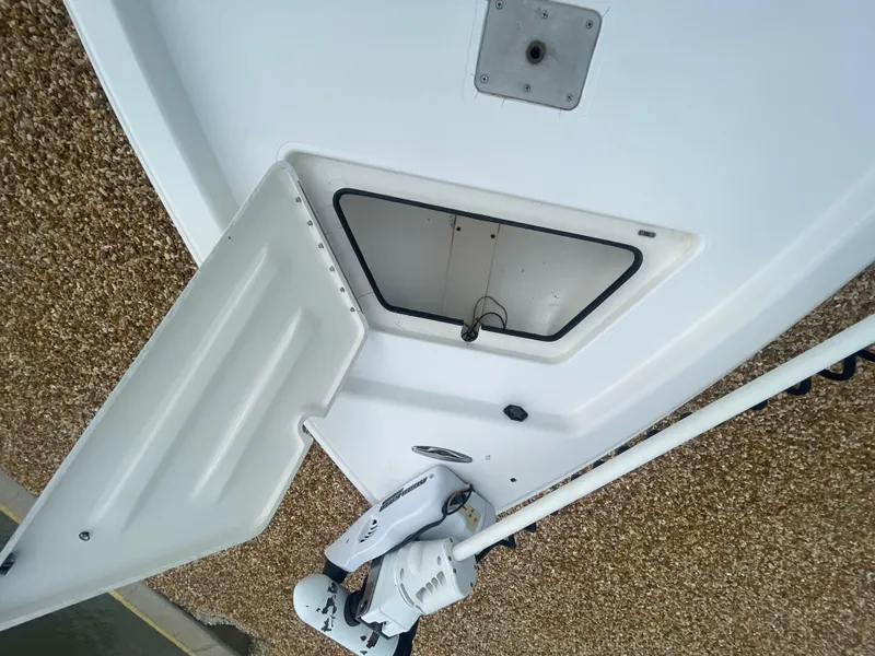 Slide: The Image of 2005 ShearWater 2200 boat deck with open hatch and mounted equipment. - 22