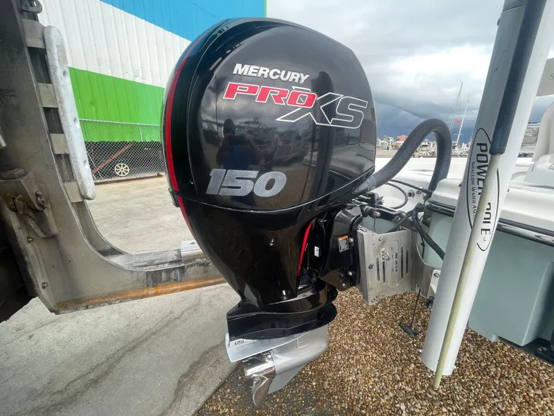 Slide: The Image of Mercury Pro XS 150 outboard motor on 2005 ShearWater 2200 boat. - 27