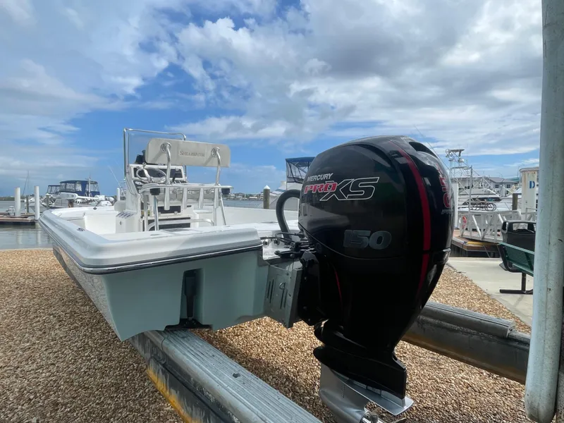 Slide: The Image of 2005 ShearWater 2200 boat with Mercury Pro XS engine at marina. - 3