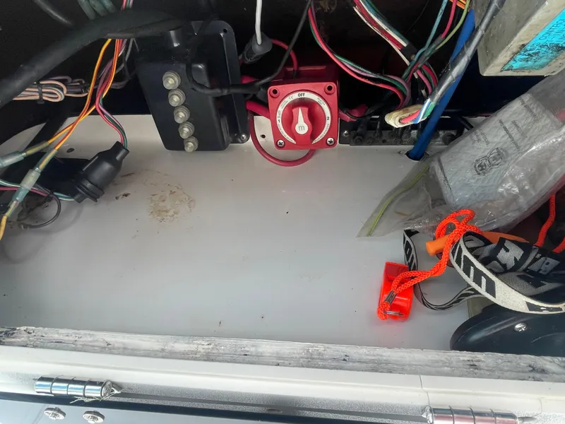 Slide: The Image of Electrical components and wiring inside a 2005 ShearWater 2200 boat compartment. - 7