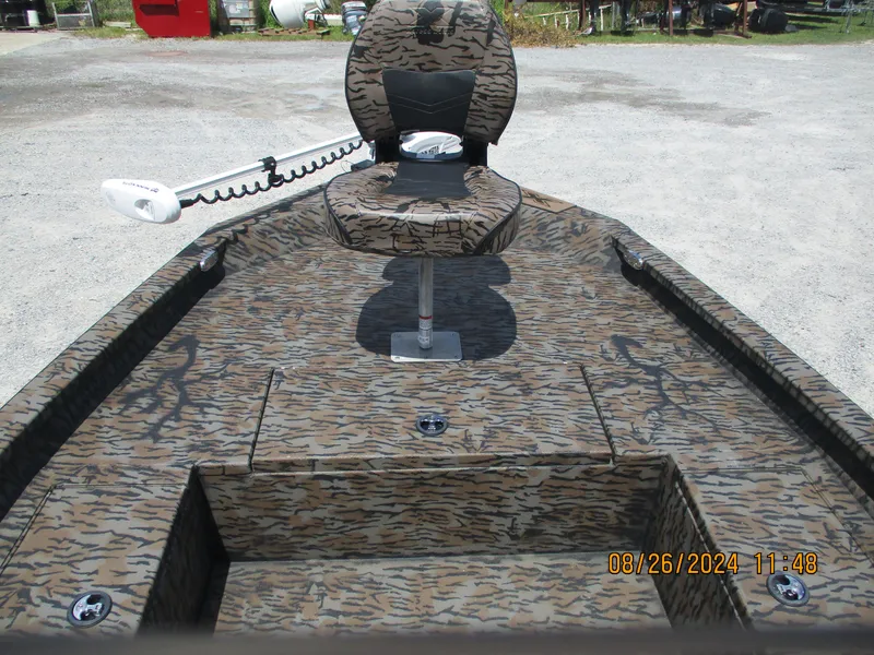 Slide: The Image of 2023 Express H20 Bay boat with camouflage design and swivel seat. - 10