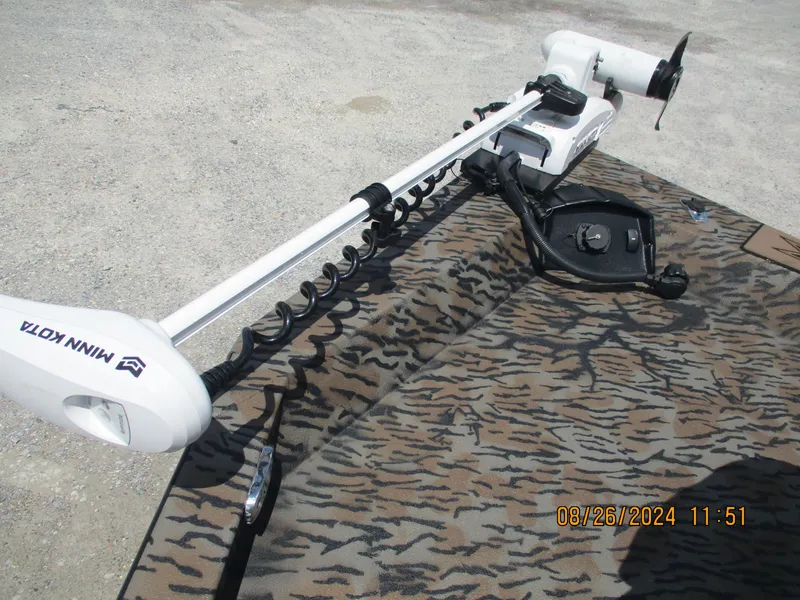 Slide: The Image of Minn Kota trolling motor on Express H20 Bay boat, 2023 model, camo pattern deck. - 12